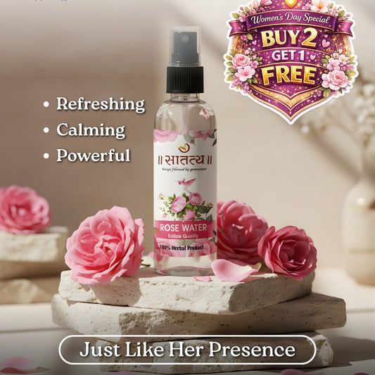 Rose water bottle with flowers on a decorative stand, featuring promotional text and branding.